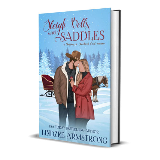 Sleigh Bells and Saddles hardback grumpy sunshine Christmas romance - Lindzee Armstrong