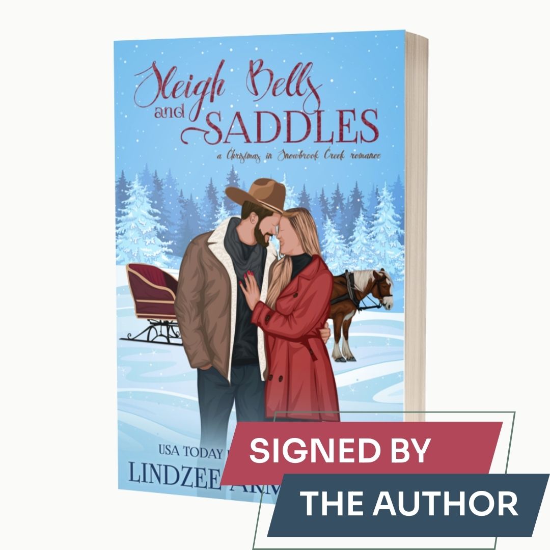 Sleigh Bells and Saddles by Lindzee Armstrong signed paperback, clean romantic comedy in the Christmas in Snowbrook Creek series